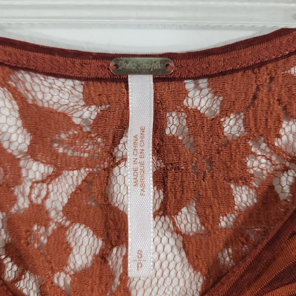 FREE PEOPLE Daydream burnt orange asymmetrical striped lace back tunic top